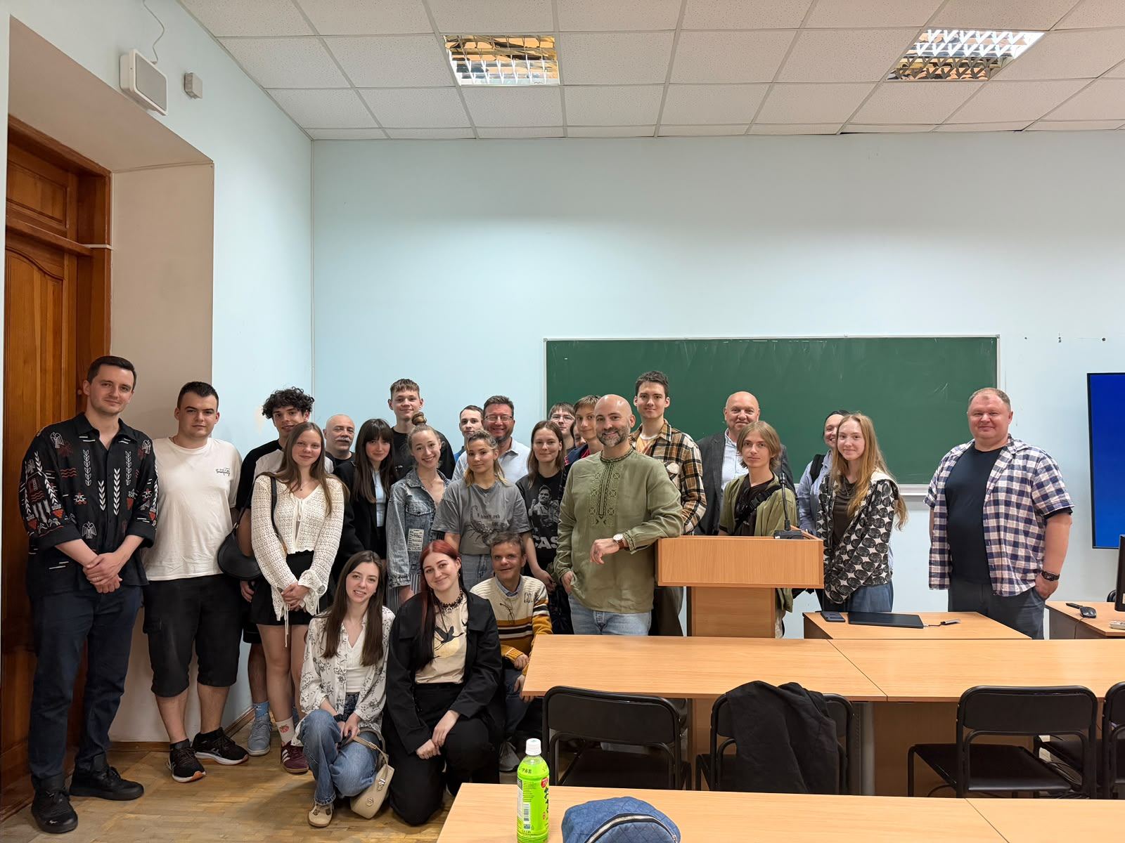 Paul Sutter and Igor Pomaz with students and faculty in a classroom at Kyiv-Mohyla Academy